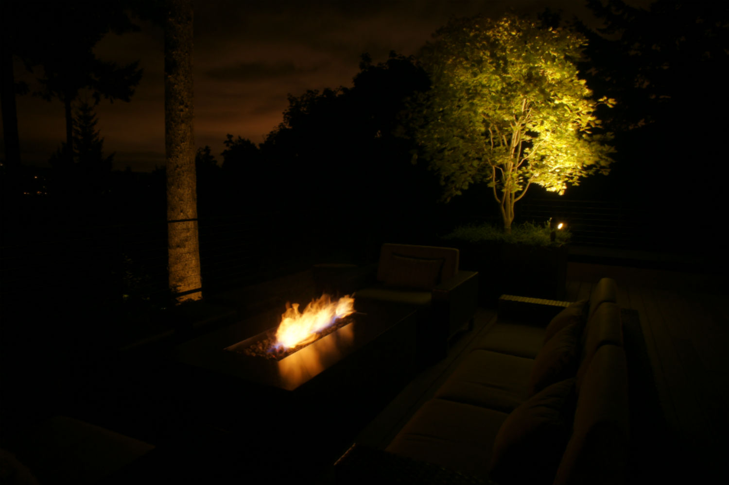Backyard fire lighting on patio in Mercer Island